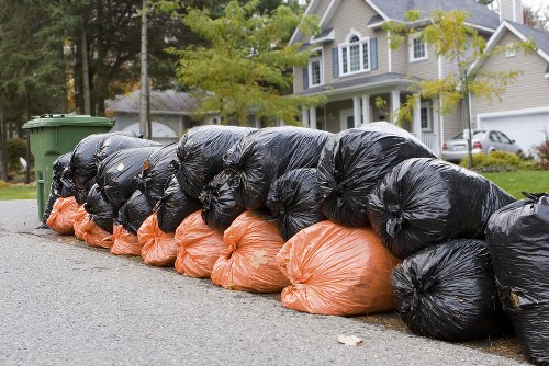 Business professionals managing waste with a skip